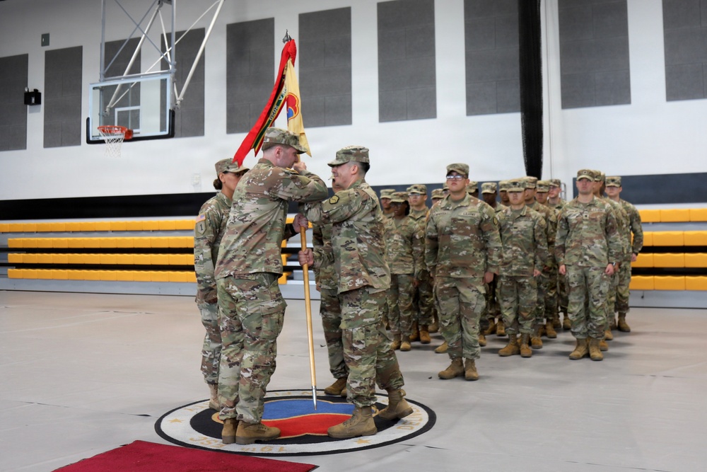 Outgoing HHC First Sergeant Passes Guidon to Commander