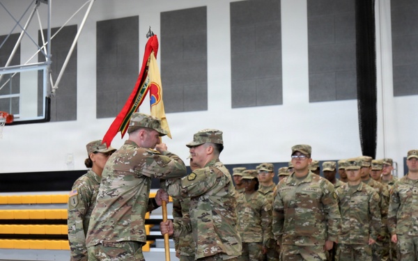 Outgoing HHC First Sergeant Passes Guidon to Commander