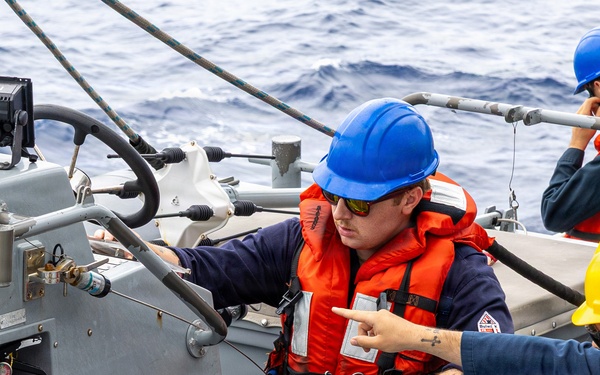 USS Mustin conducts boat operations