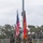 Strength in Every Step: Laps For Life event supports suicide awareness A U.S. Marine Corps Color Guard stands at attention on a football field, presenting the United States national flag and the Marine Corps flag with battle streamers. The four Marines are in full dress woodland MARPAT camouflage uniforms with rifles and ceremonial equipment. The ceremony appears to be taking place at an outdoor athletic stadium with bleachers visible in the background.