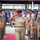 U.S. Navy Chief Petty Officer walks the sideboy gauntlet during a chief pinning ceremony