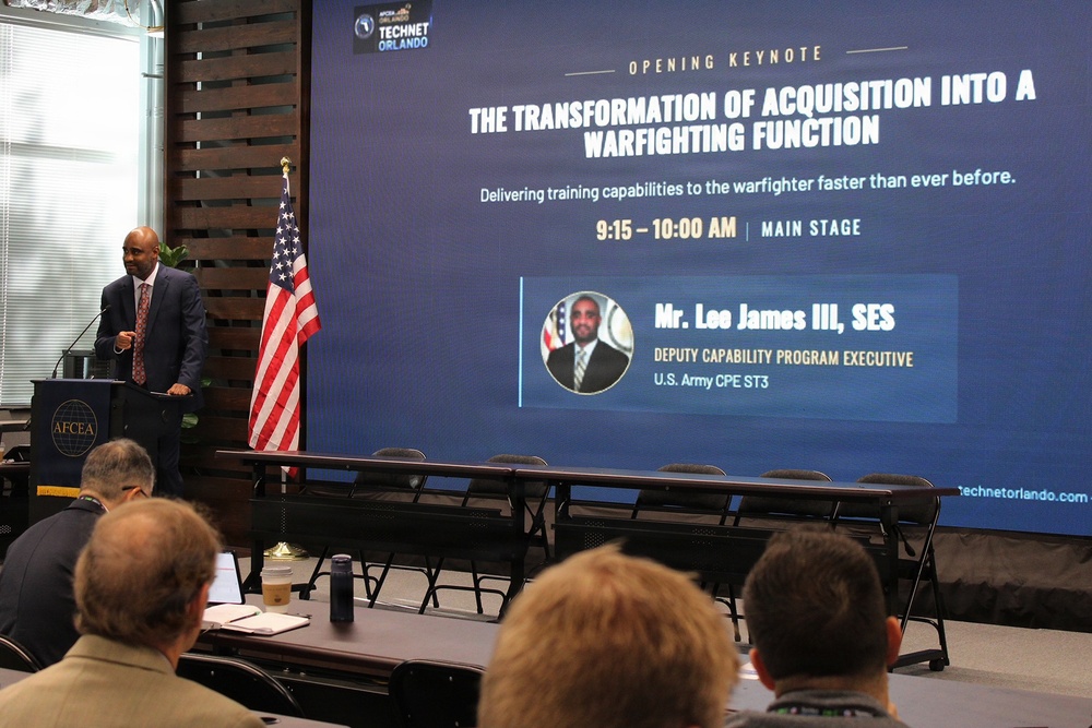 An opening keynote presentation at AFCEA TechNet Orlando conference is underway. The speaker, identified on the slide as Mr. Lee James III, SES, Deputy Capability Program Executive for U.S. Army CPE ST3, is presenting on 'The Transformation of Acquisition into a Warfighting Function.' The session is scheduled from 9:15–10:00 AM on the Main Stage.
