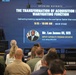 An opening keynote presentation at an AFCEA conference in Orlando, titled 'The Transformation of Acquisition into a Warfighting Function.' A speaker stands at an AFCEA-branded podium addressing a seated audience, with a large presentation screen displaying session details. The featured speaker is identified as Mr. Lee James III, SES, Deputy Capability Program Executive, U.S. Army CPE ST3.