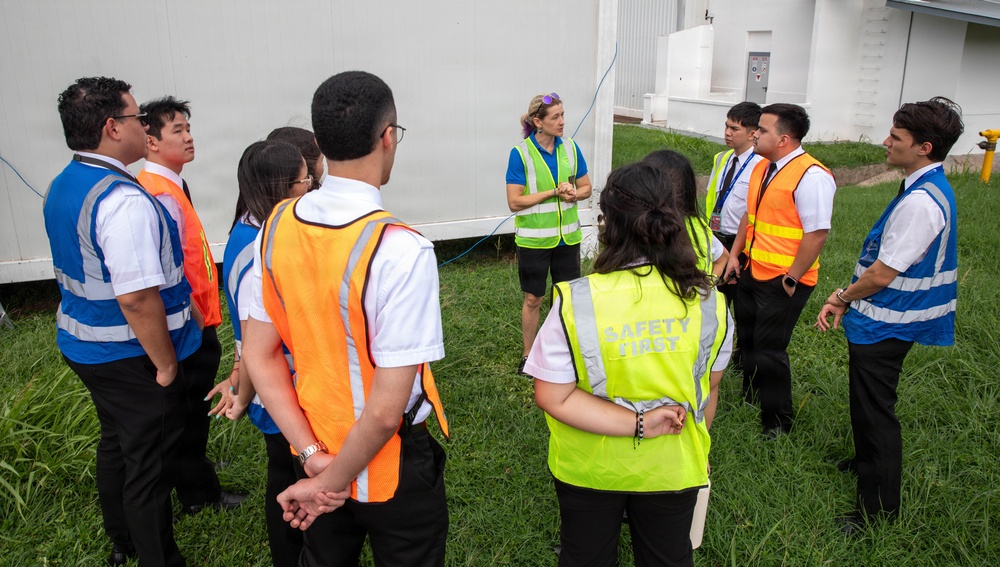 NASA pilots and Panamanian flight students tour a WB-57F aircraft after a flight exercise