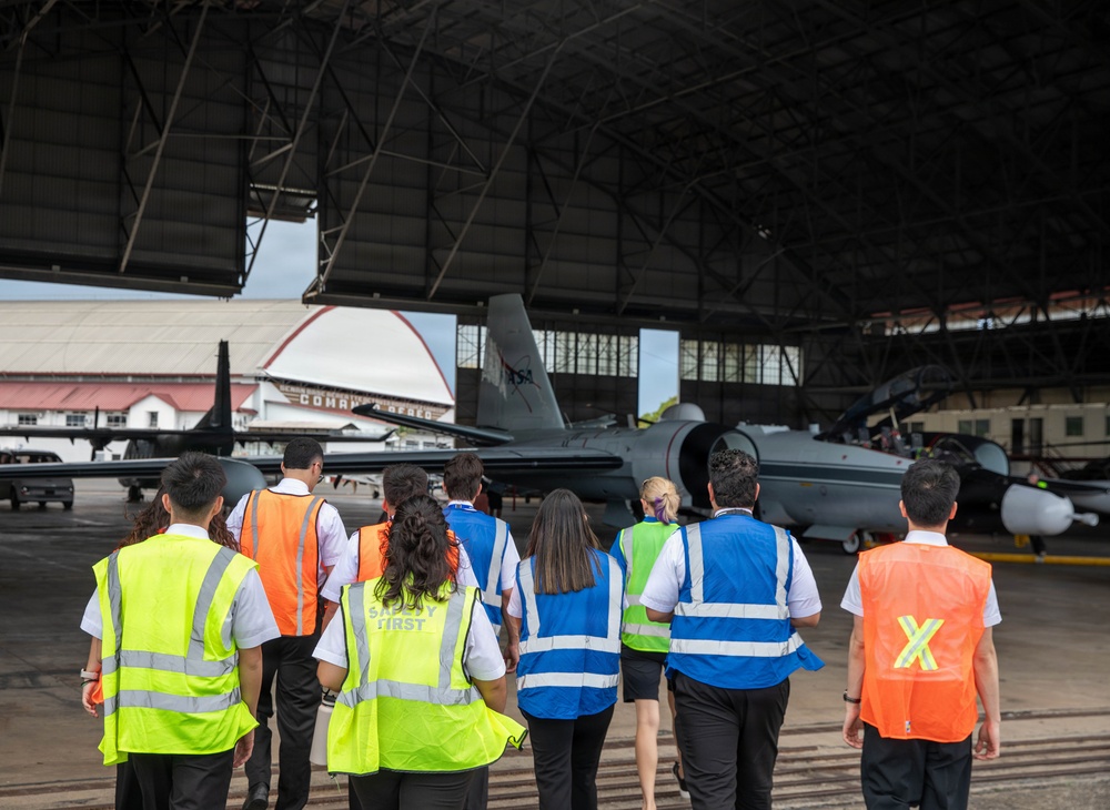 NASA pilots and Panamanian flight students tour a WB-57F aircraft after a flight exercise
