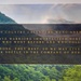 The image displays an inspirational military quote by John Warley overlaid on a scenic landscape photograph featuring forested hills and a misty sky. The quote references the WVNG (West Virginia National Guard) and honors fallen warriors. It serves as a commemorative or memorial tribute graphic.