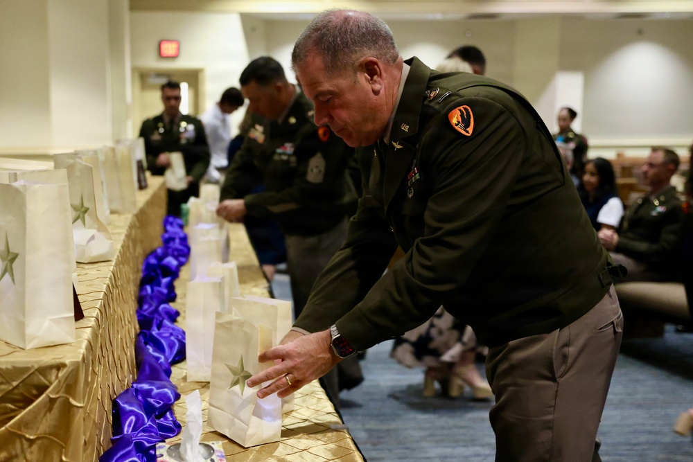 Fort Rucker commemorates Gold Star Mothers and Families Day with luminary service