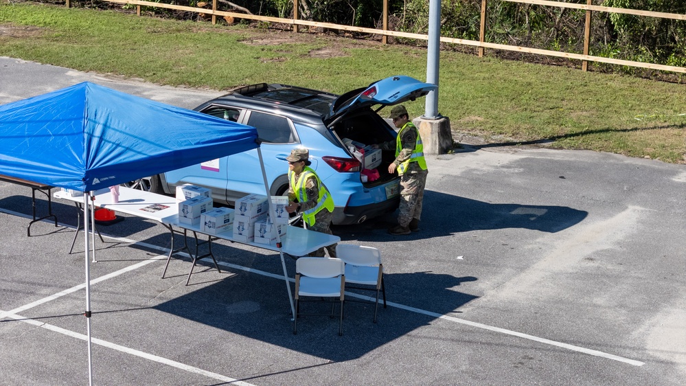Florida Army National Guard Soldiers distribute aid in the aftermath of Hurricane Isaias